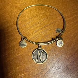 Gold letter “N” adjustable Alex and ani bracelet in great condition.